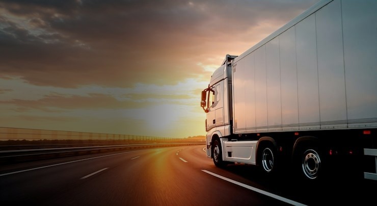CARE Logistics last-mile delivery truck at dusk